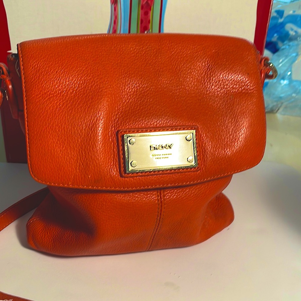 DKNYC (Leather) Shoulder Bag and the Color is a Burnt Orange.